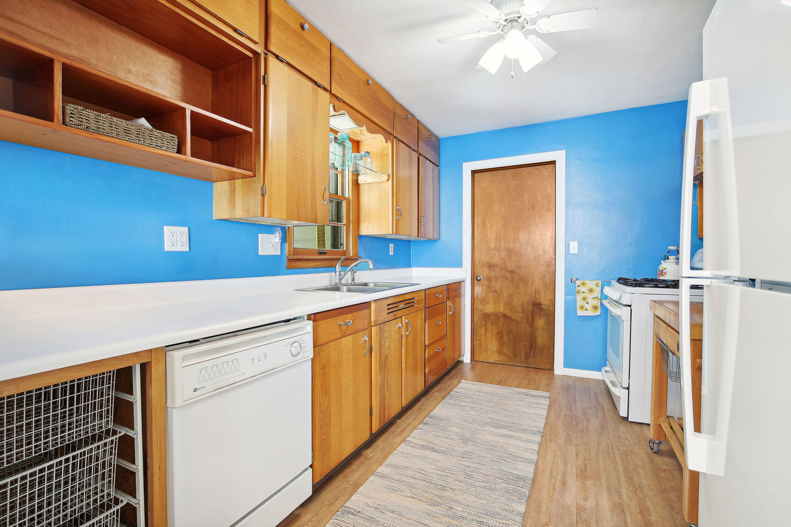 1008 South Mattis Avenue Champaign, IL 61821 - Photo 9 of 25 a kitchen with a sink and a refrigerator