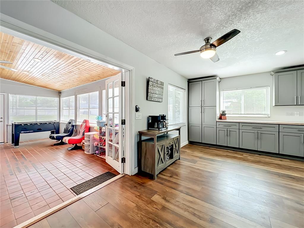 153 Variety Tree Circle Altamonte Springs, FL 32714 - Photo 16 of 44 a kitchen that has a lot of cabinets and wooden floor