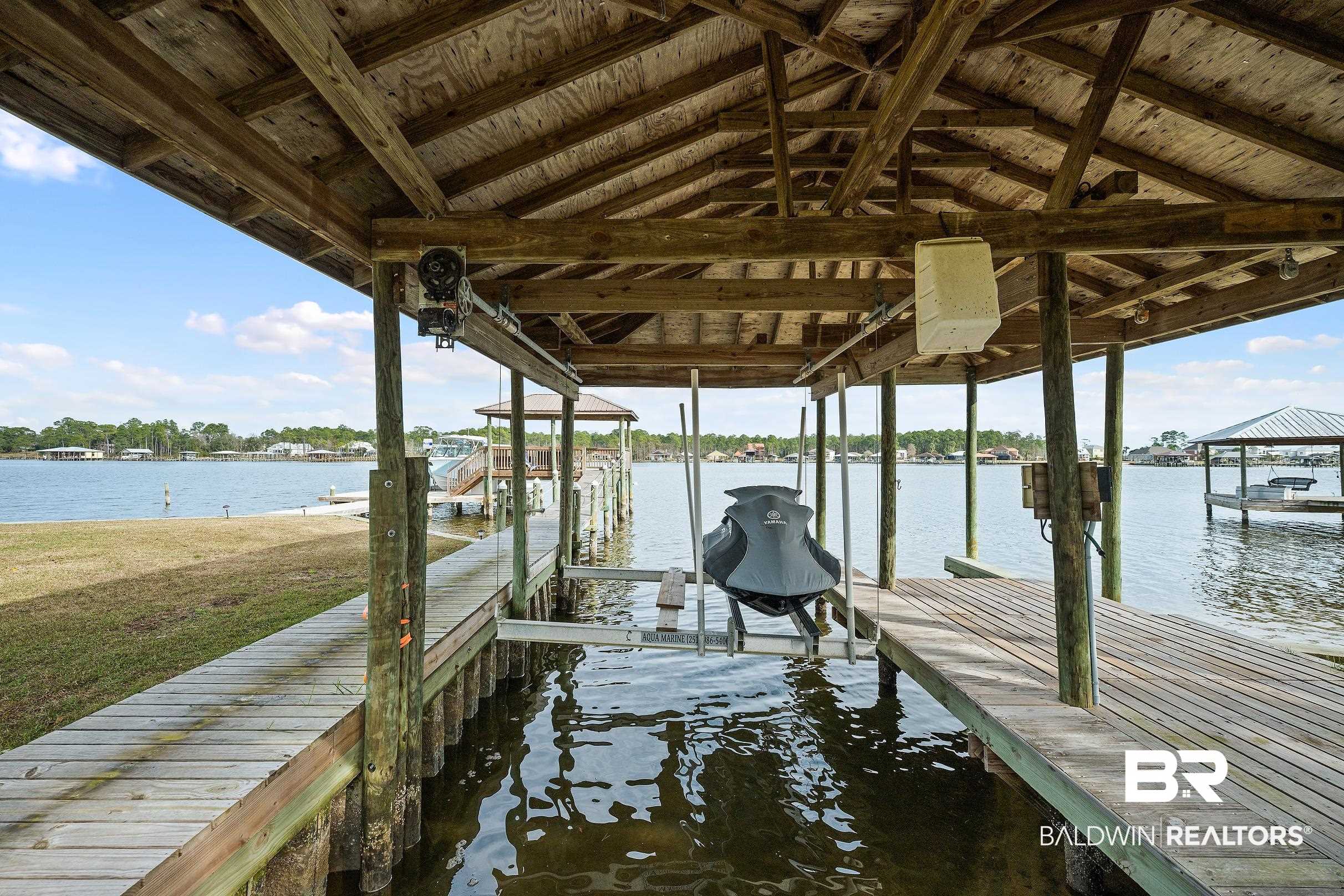 8490 Bay View Drive Foley, AL 36535 - Photo 11 of 67 Dock area with boat lift and a water view
