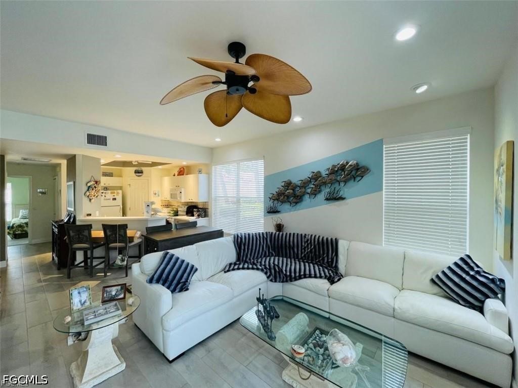 14971 Rivers Edge Court, Unit 101 Fort Myers, FL 33908 - Photo 5 of 9 a living room with furniture