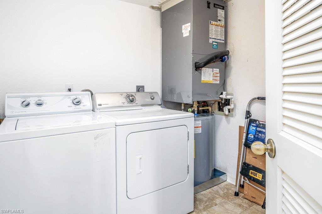 379 Gabriel Circle, Unit 2301 Naples, FL 34104 - Photo 24 of 33 a utility room with dryer and washer