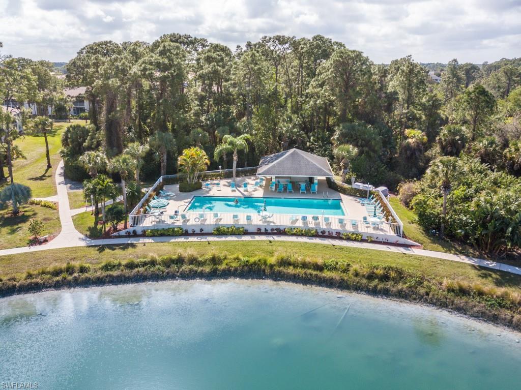 379 Gabriel Circle, Unit 2301 Naples, FL 34104 - Photo 26 of 33 a view of swimming pool and lake view