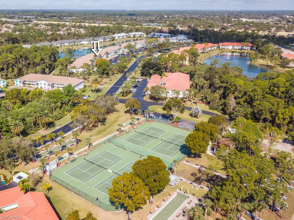 379 Gabriel Circle, Unit 2301 Naples, FL 34104 - Photo 27 of 33 an aerial view of residential houses with outdoor space