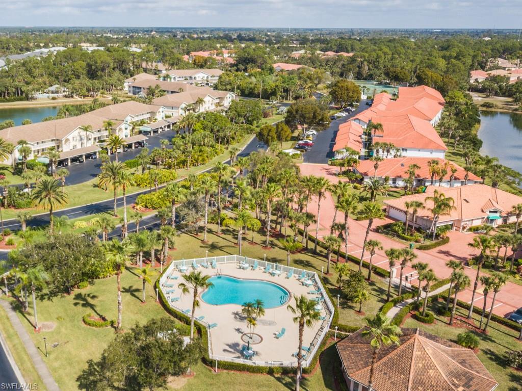 379 Gabriel Circle, Unit 2301 Naples, FL 34104 - Photo 28 of 33 an aerial view of residential houses with outdoor space