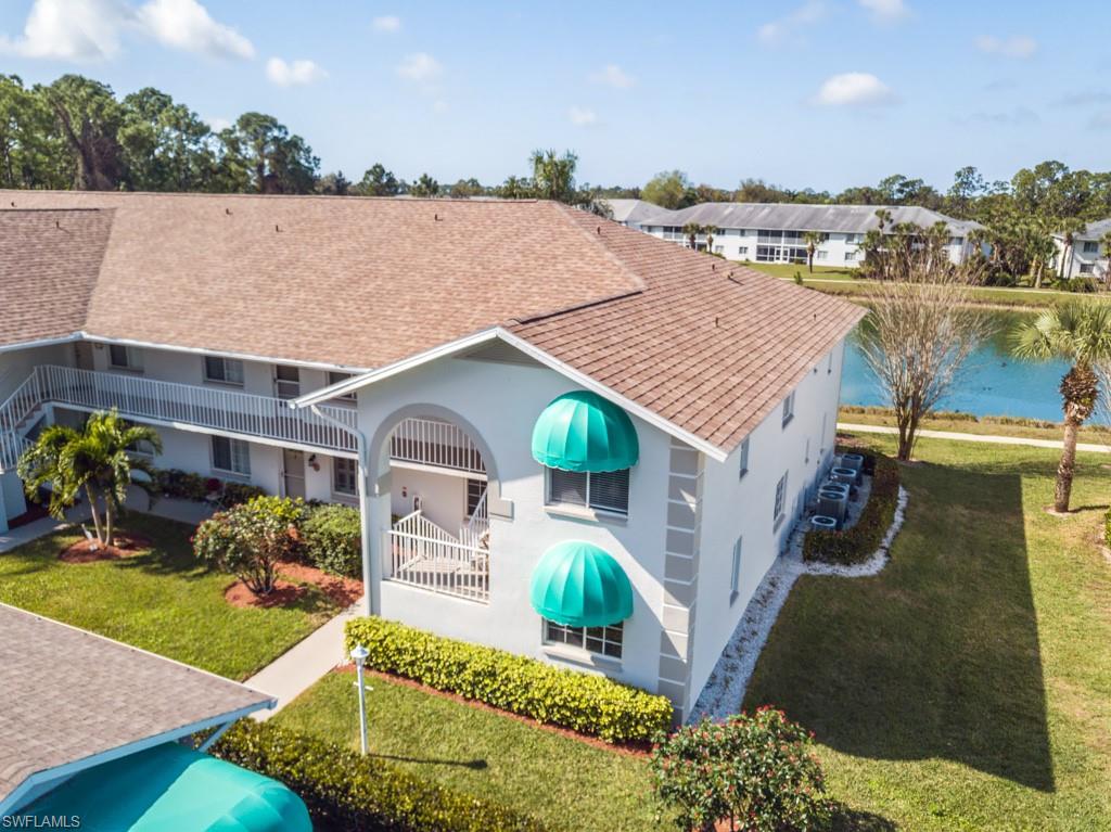 379 Gabriel Circle, Unit 2301 Naples, FL 34104 - Photo 3 of 33 an aerial view of a house with a yard and potted plants