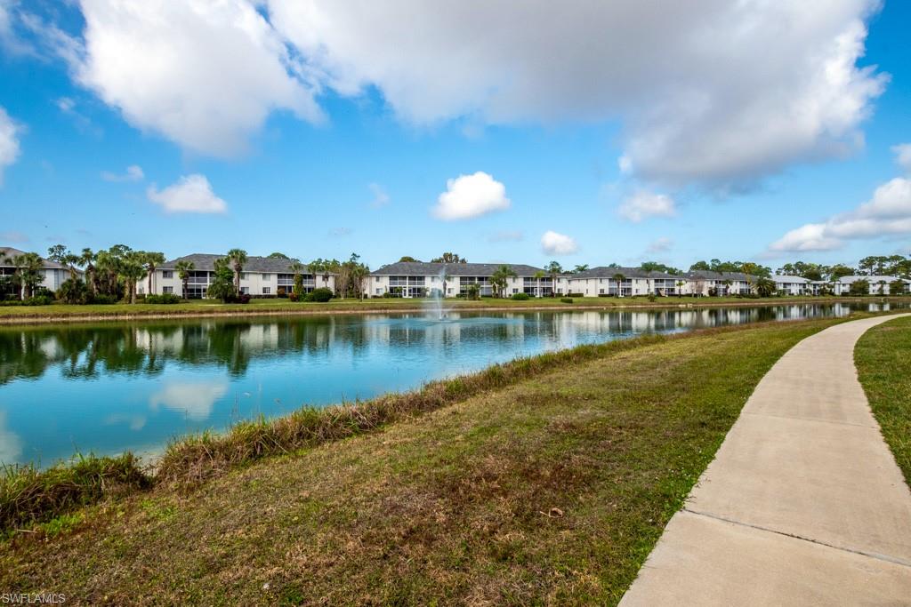 379 Gabriel Circle, Unit 2301 Naples, FL 34104 - Photo 31 of 33 a view of a lake with houses in the back