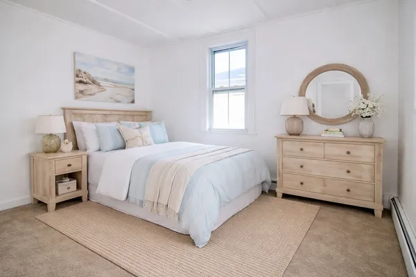 a bedroom with a bed and dresser