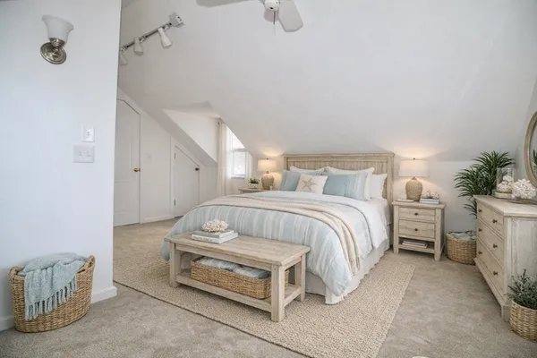 a bedroom with a bed and a cabinets