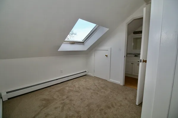 an empty room with a bench