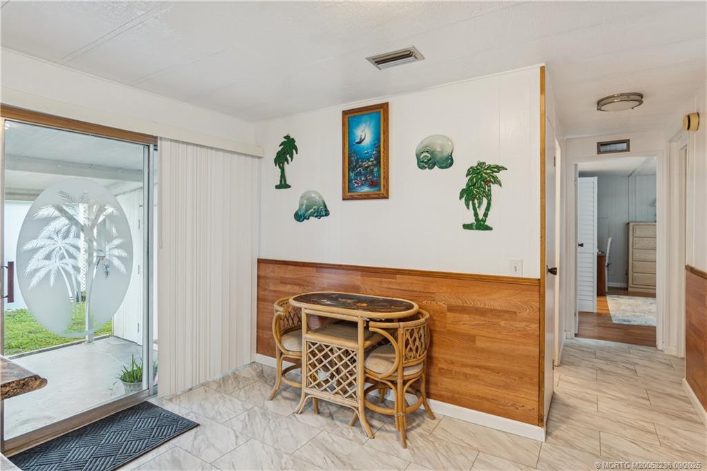 4800 Southeast Federal Highway, Unit 72 Stuart, FL 34997 - Photo 20 of 22 a view of a livingroom with furniture and a potted plant
