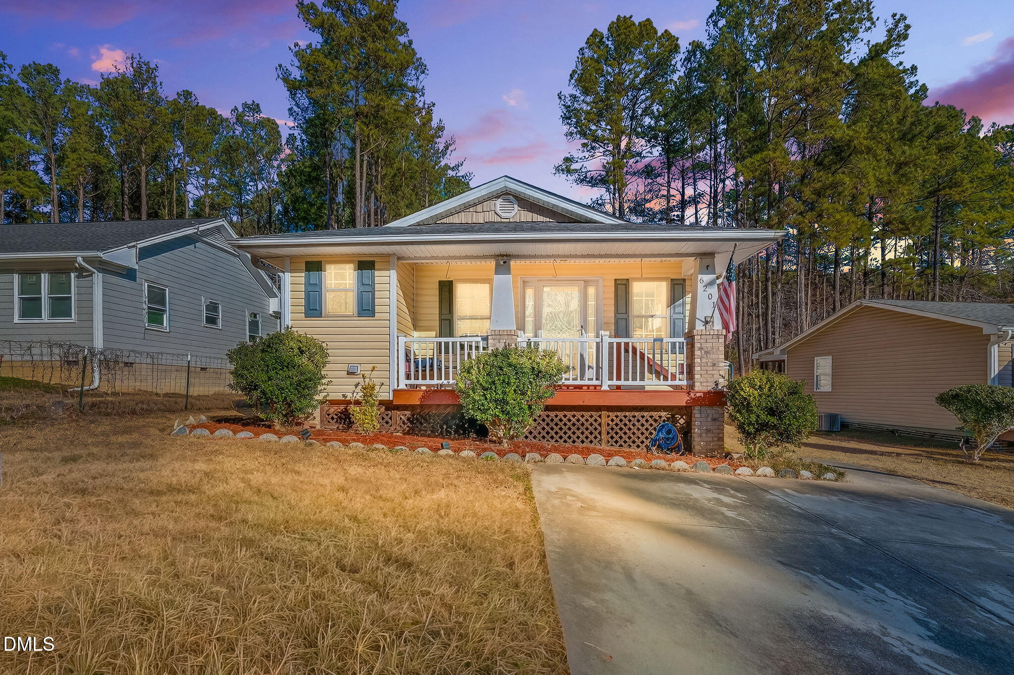 6201 Barrington Village Lane Raleigh, NC 27610 - Photo 1 of 25 a front view of a house with garden