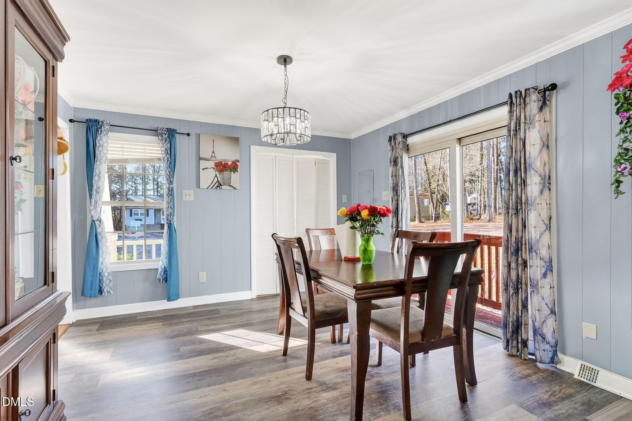 6201 Barrington Village Lane Raleigh, NC 27610 - Photo 11 of 25 a view of a dining room with furniture window and wooden floor
