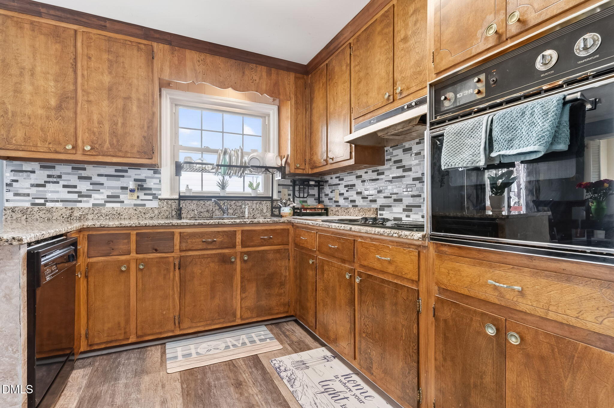 6201 Barrington Village Lane Raleigh, NC 27610 - Photo 13 of 25 a kitchen with stainless steel appliances granite countertop a sink and cabinets