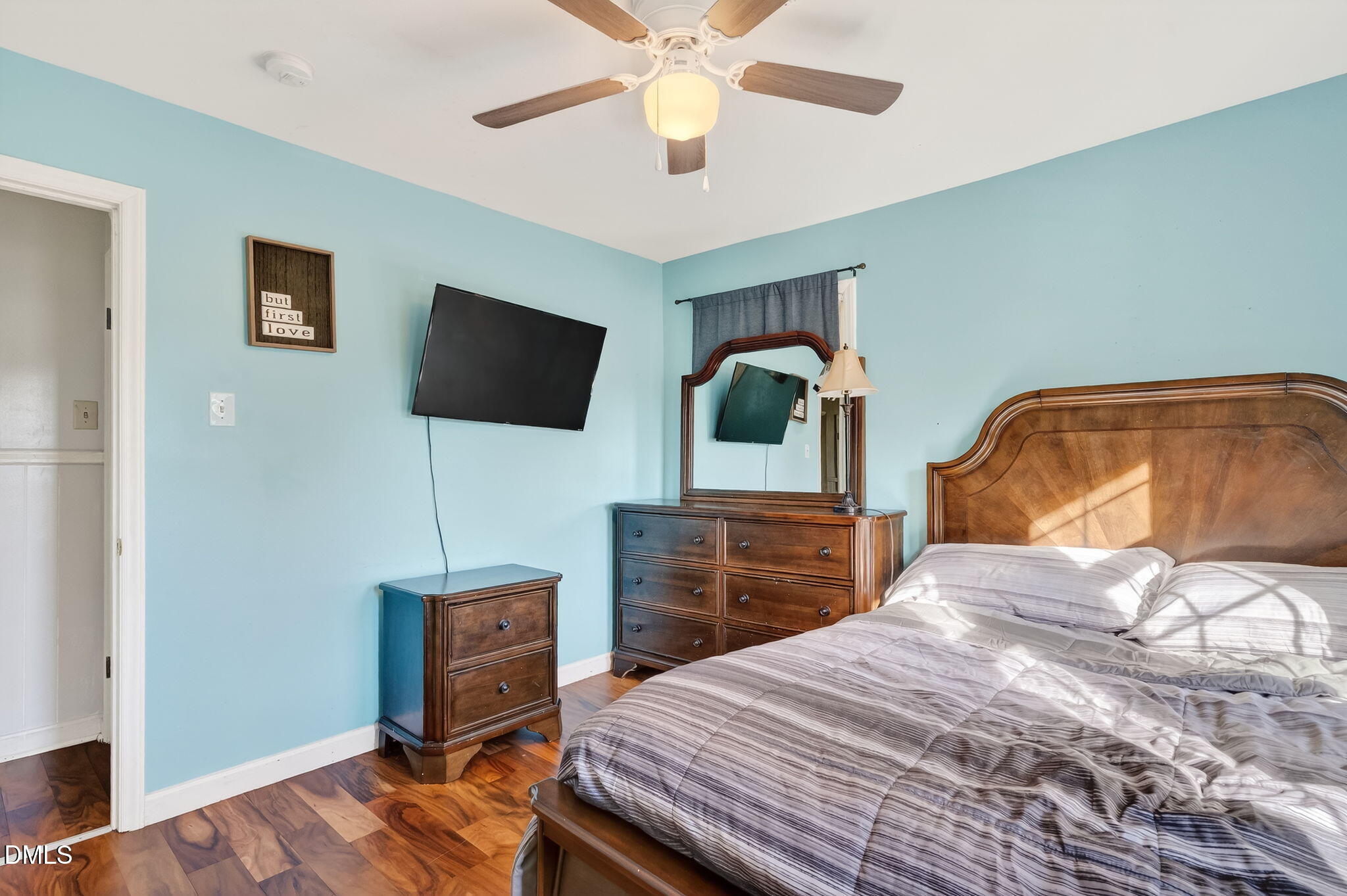 6201 Barrington Village Lane Raleigh, NC 27610 - Photo 15 of 25 a bedroom with a bed and a flat screen tv