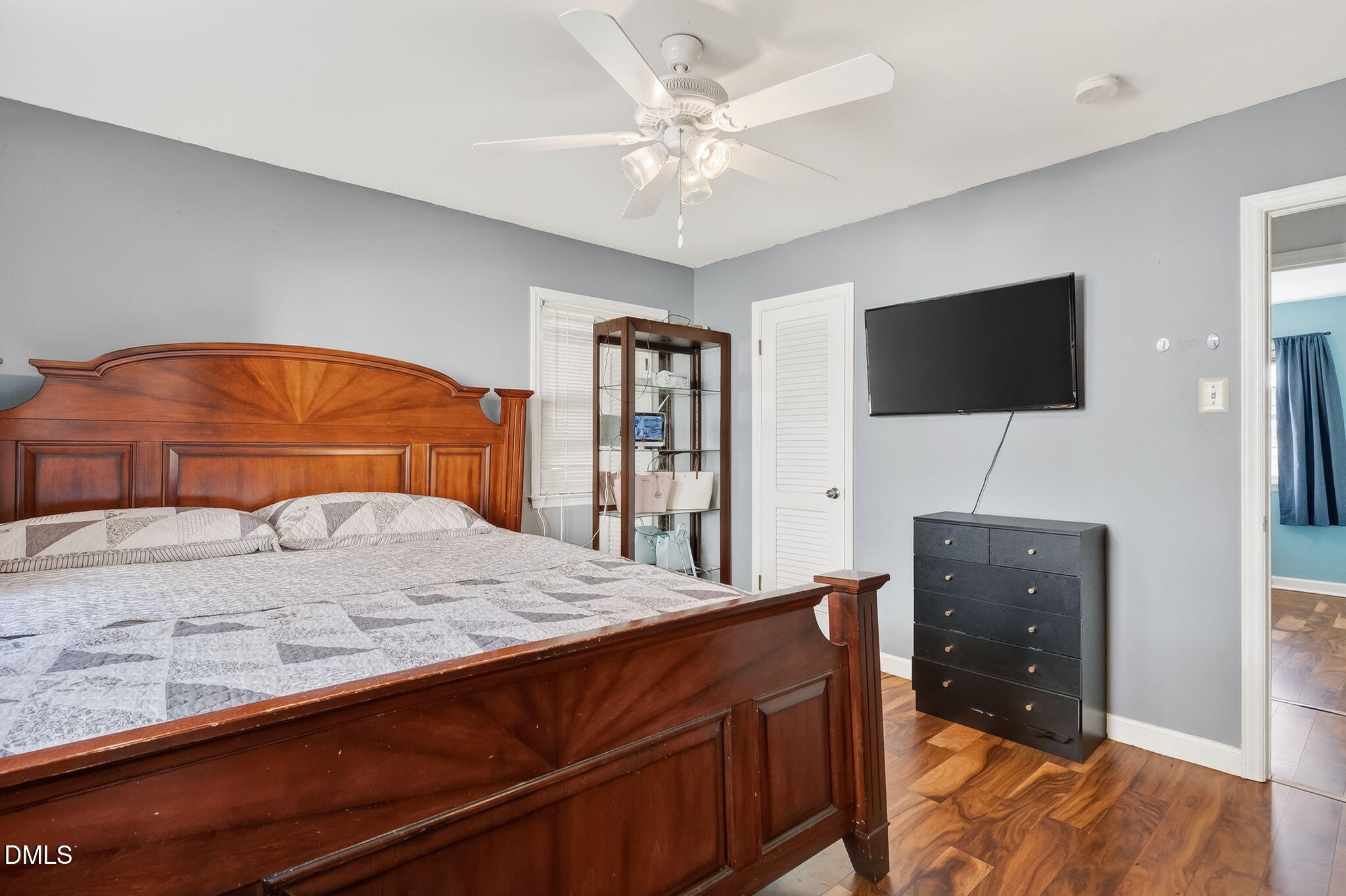 6201 Barrington Village Lane Raleigh, NC 27610 - Photo 16 of 25 a bedroom with a bed and a flat screen tv