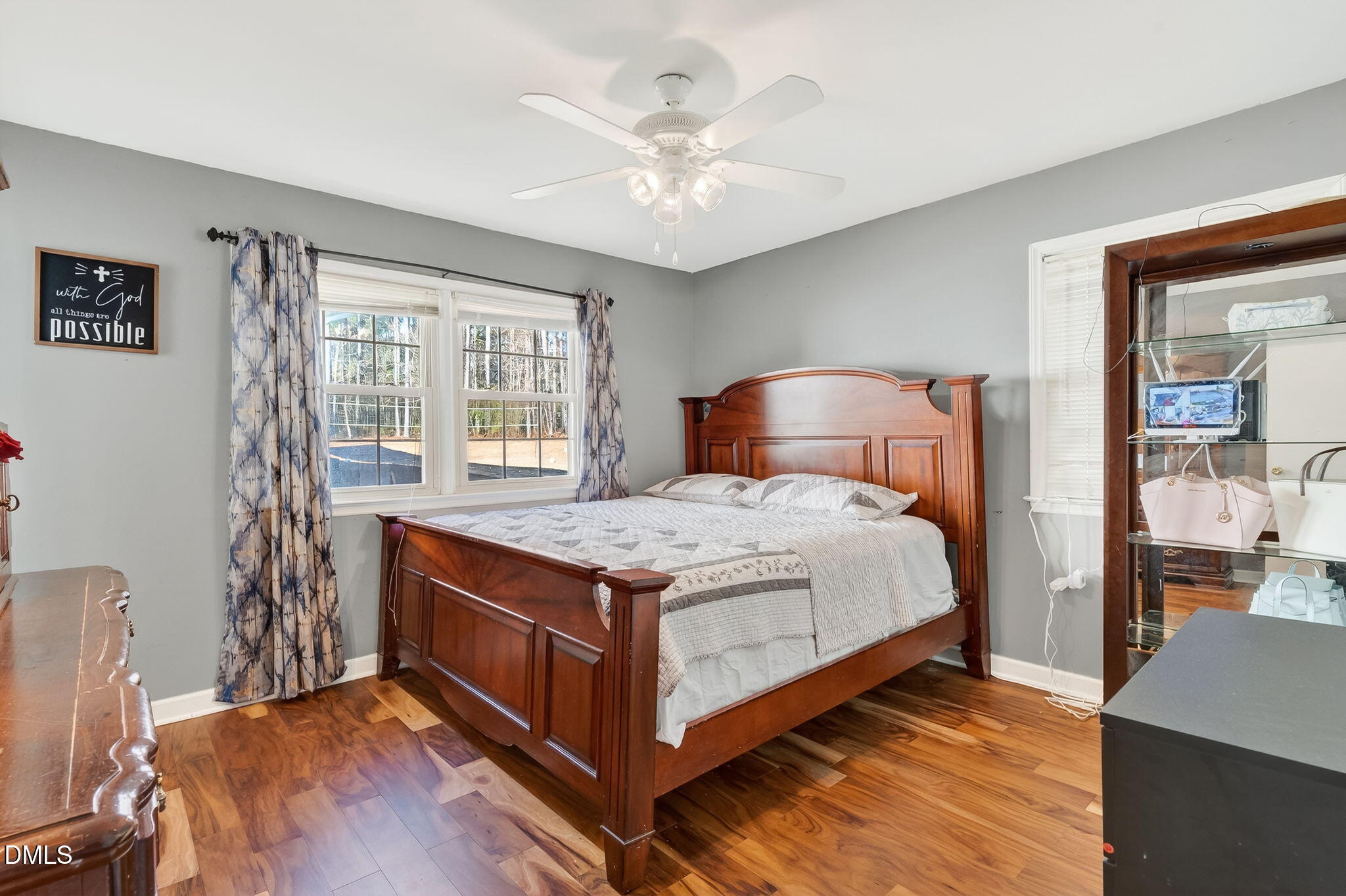 6201 Barrington Village Lane Raleigh, NC 27610 - Photo 17 of 25 a bedroom with a bed and a chandelier