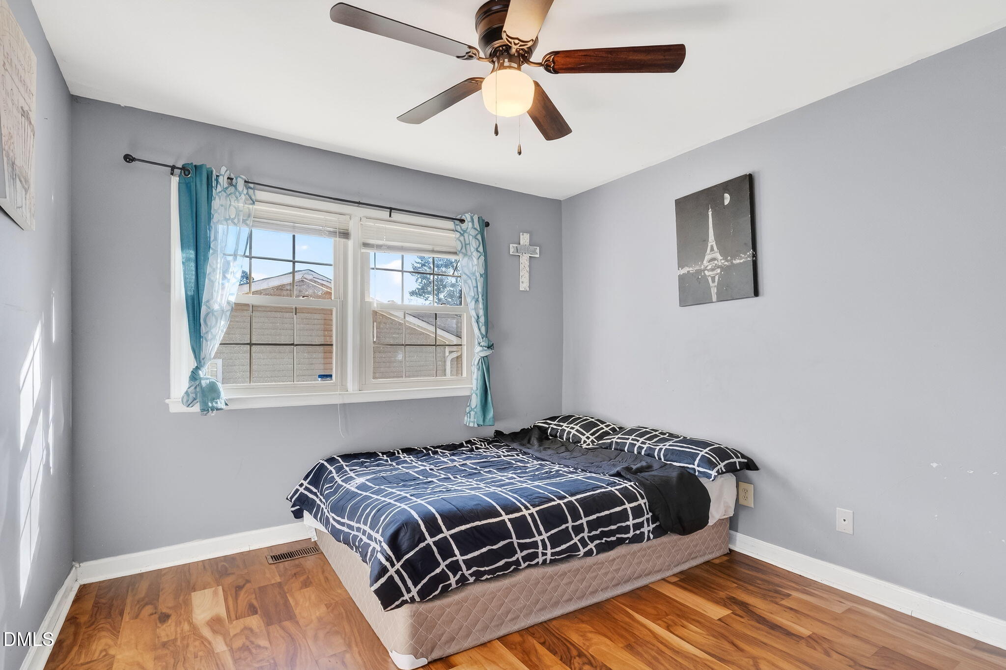 6201 Barrington Village Lane Raleigh, NC 27610 - Photo 18 of 25 a bedroom with a bed and a window
