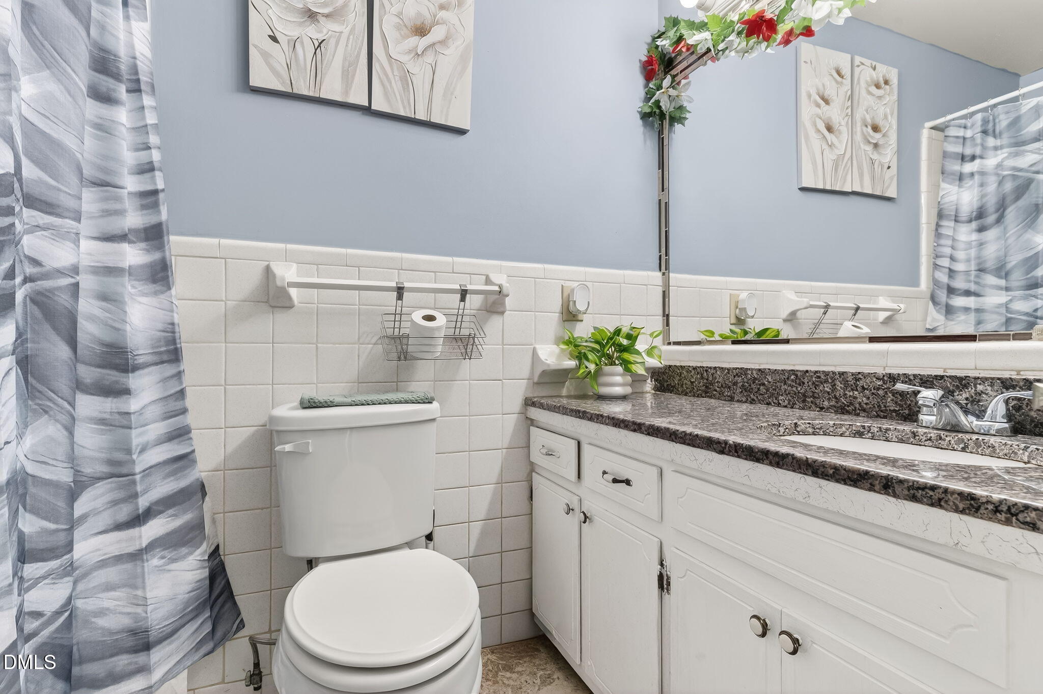 6201 Barrington Village Lane Raleigh, NC 27610 - Photo 21 of 25 a bathroom with a granite countertop toilet sink and mirror