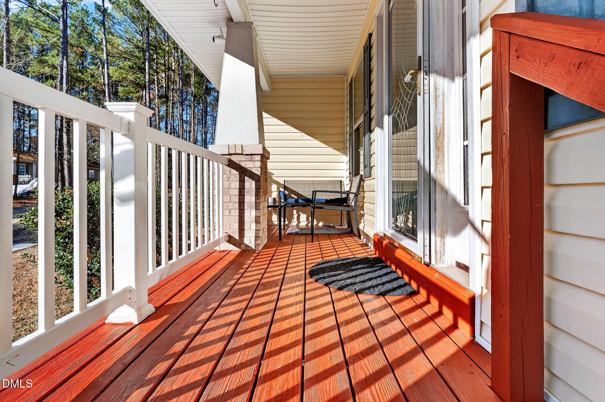 6201 Barrington Village Lane Raleigh, NC 27610 - Photo 5 of 25 a balcony with chairs and wooden floor