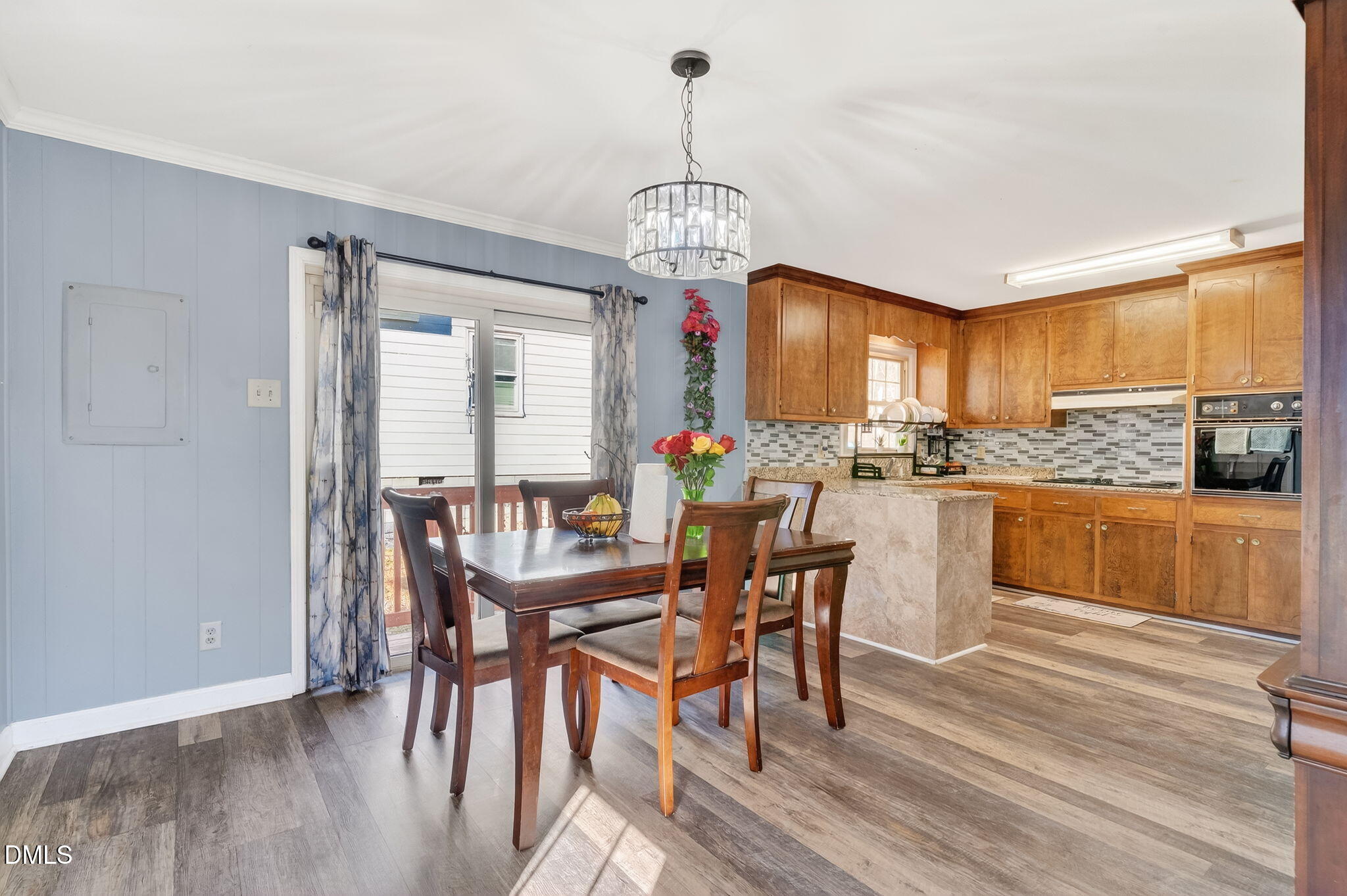 6201 Barrington Village Lane Raleigh, NC 27610 - Photo 9 of 25 a view of a dining room with furniture window and wooden floor