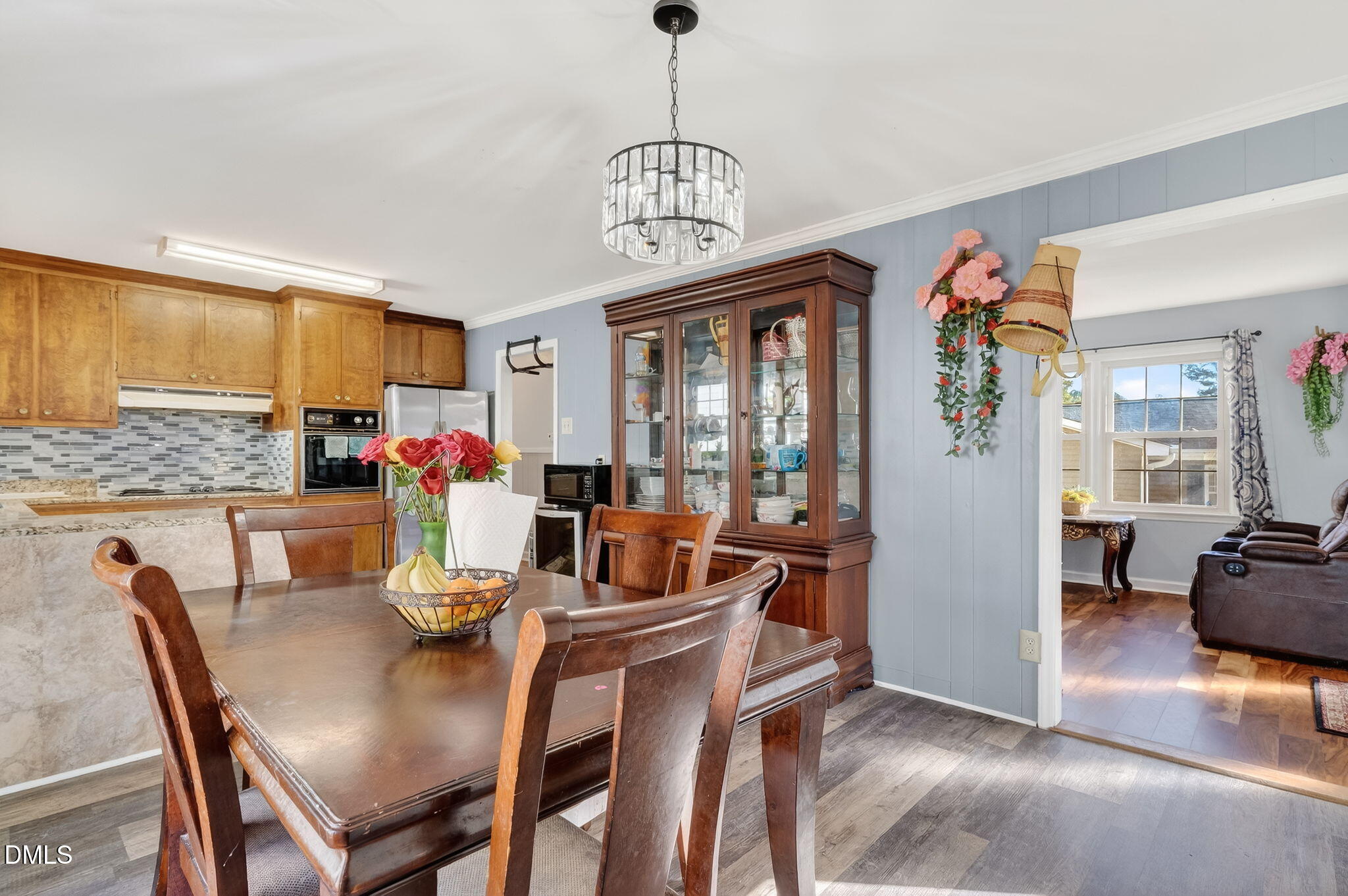 6201 Barrington Village Lane Raleigh, NC 27610 - Photo 10 of 25 a view of a dining room with furniture window and wooden floor