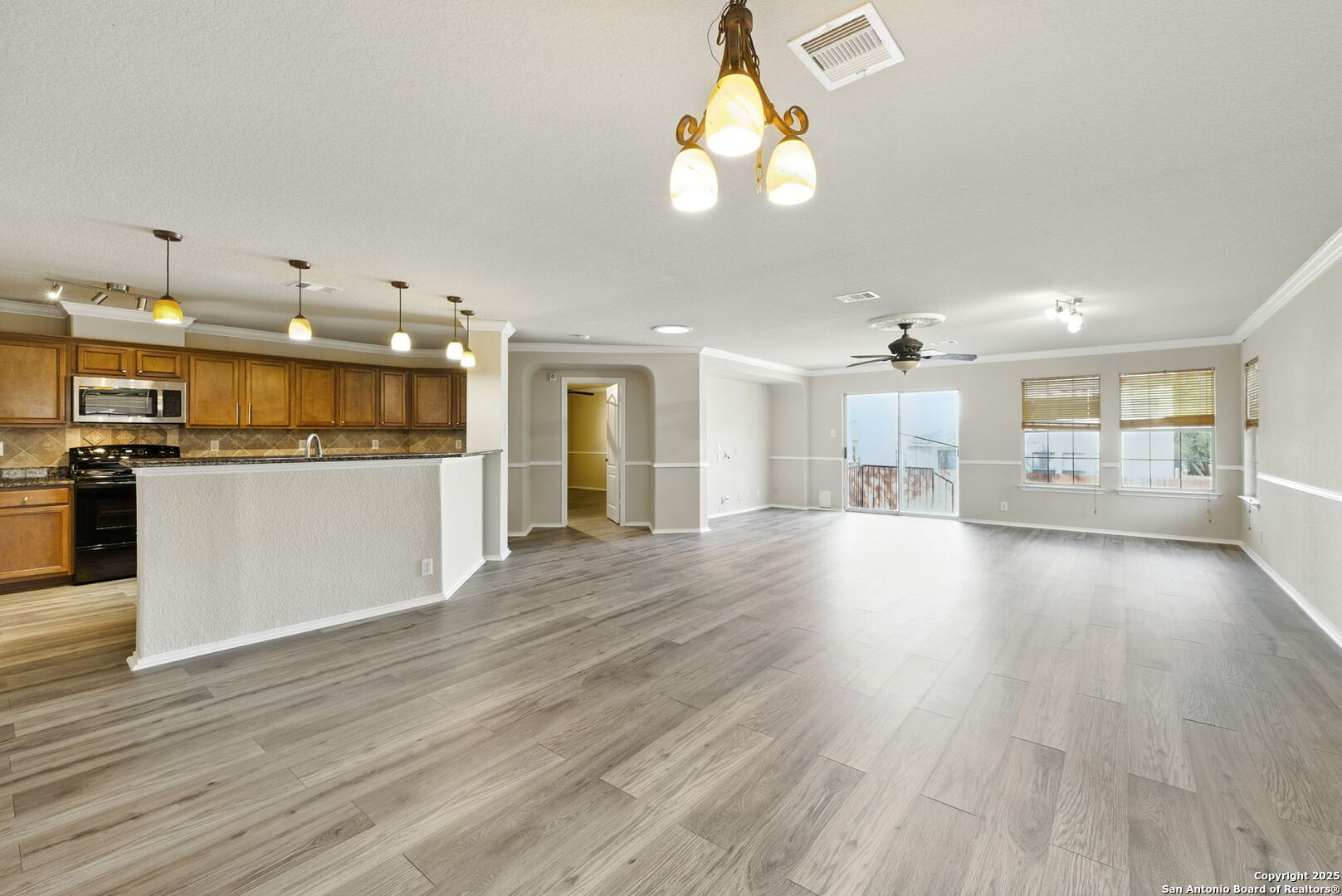 506 Leafy Ridge San Antonio, TX 78251 - Photo 13 of 48 a view of a kitchen with a sink cabinets and wooden floor