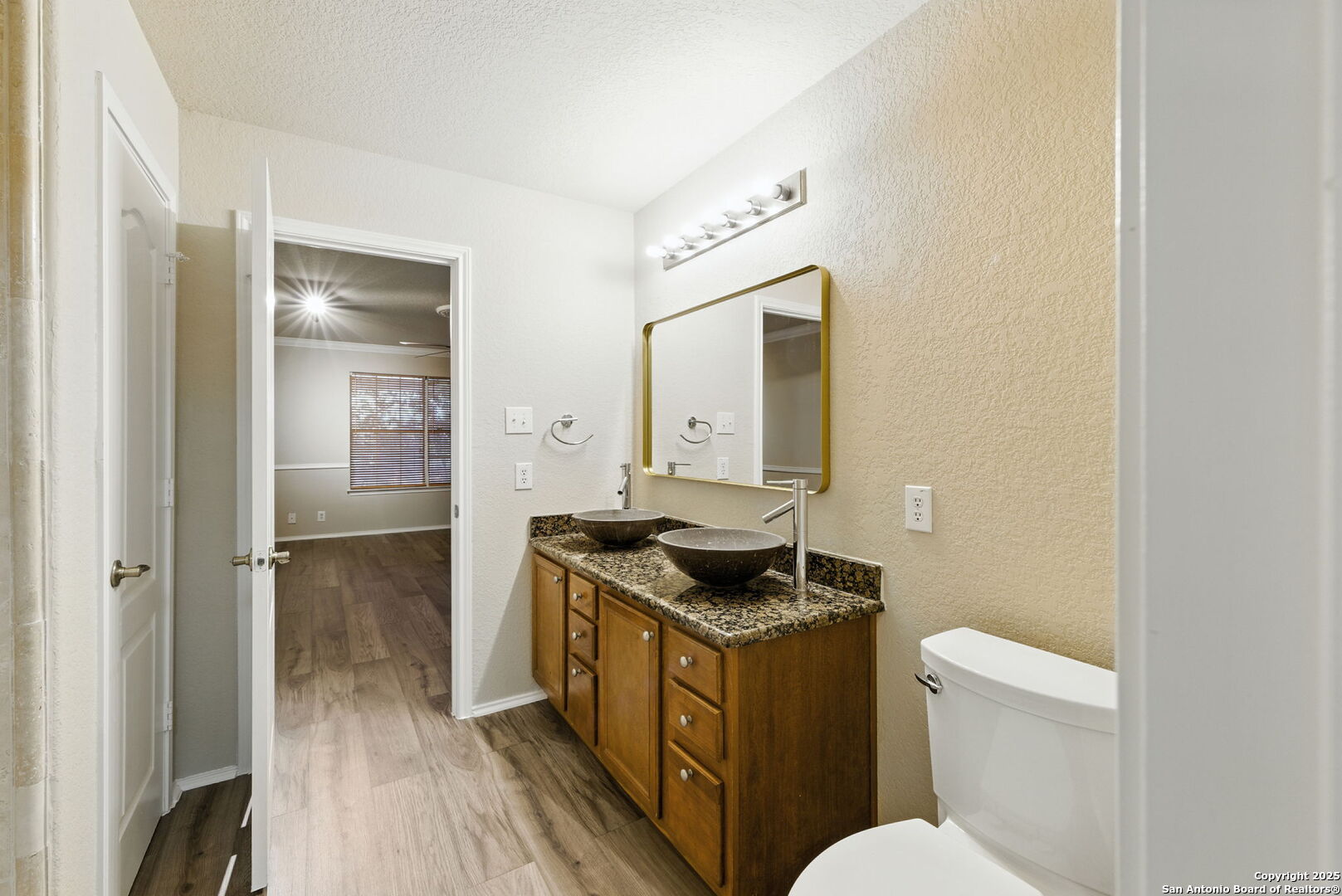 506 Leafy Ridge San Antonio, TX 78251 - Photo 17 of 48 a bathroom with a granite countertop sink and a mirror