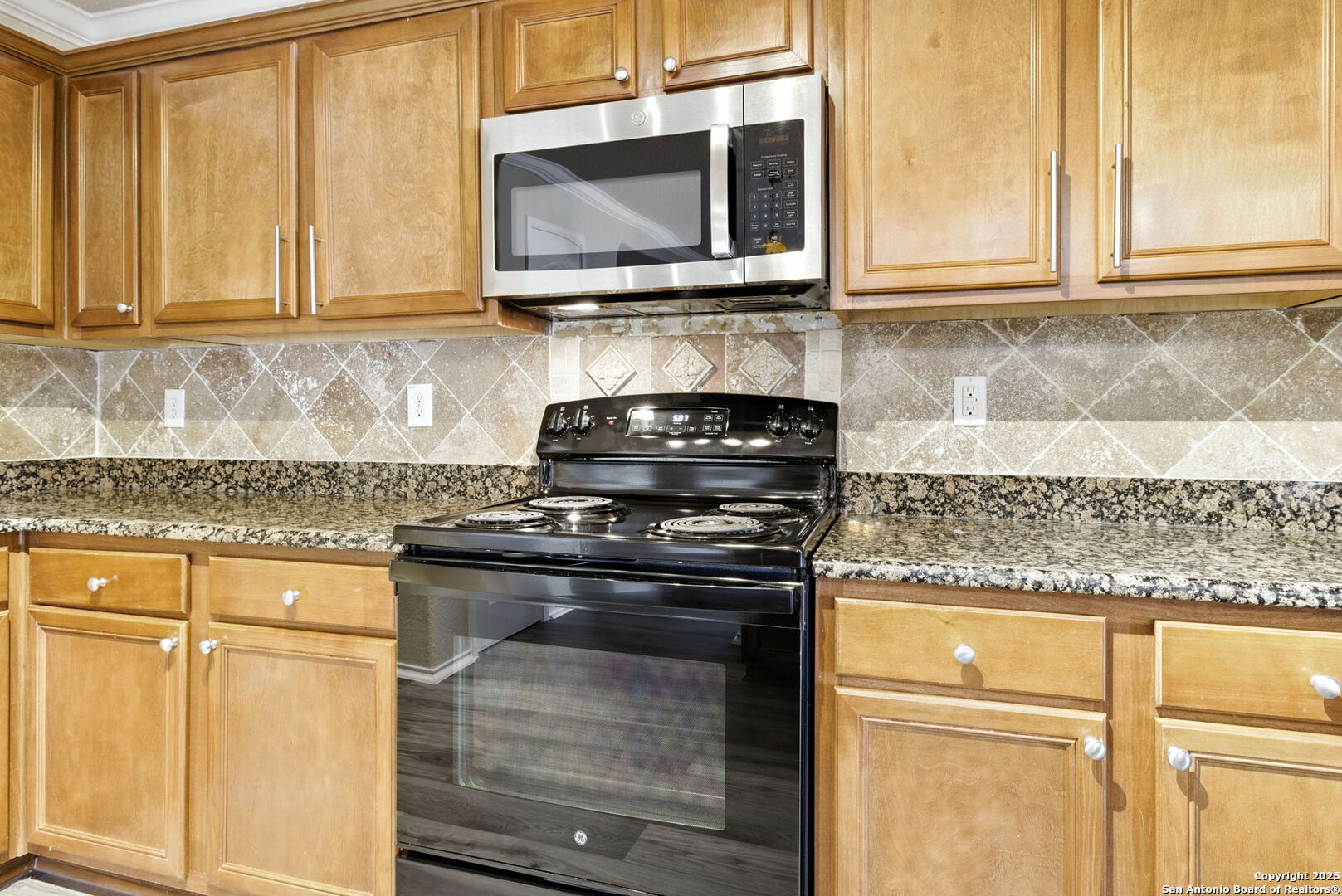 506 Leafy Ridge San Antonio, TX 78251 - Photo 26 of 48 a kitchen with granite countertop cabinets stainless steel appliances and a sink