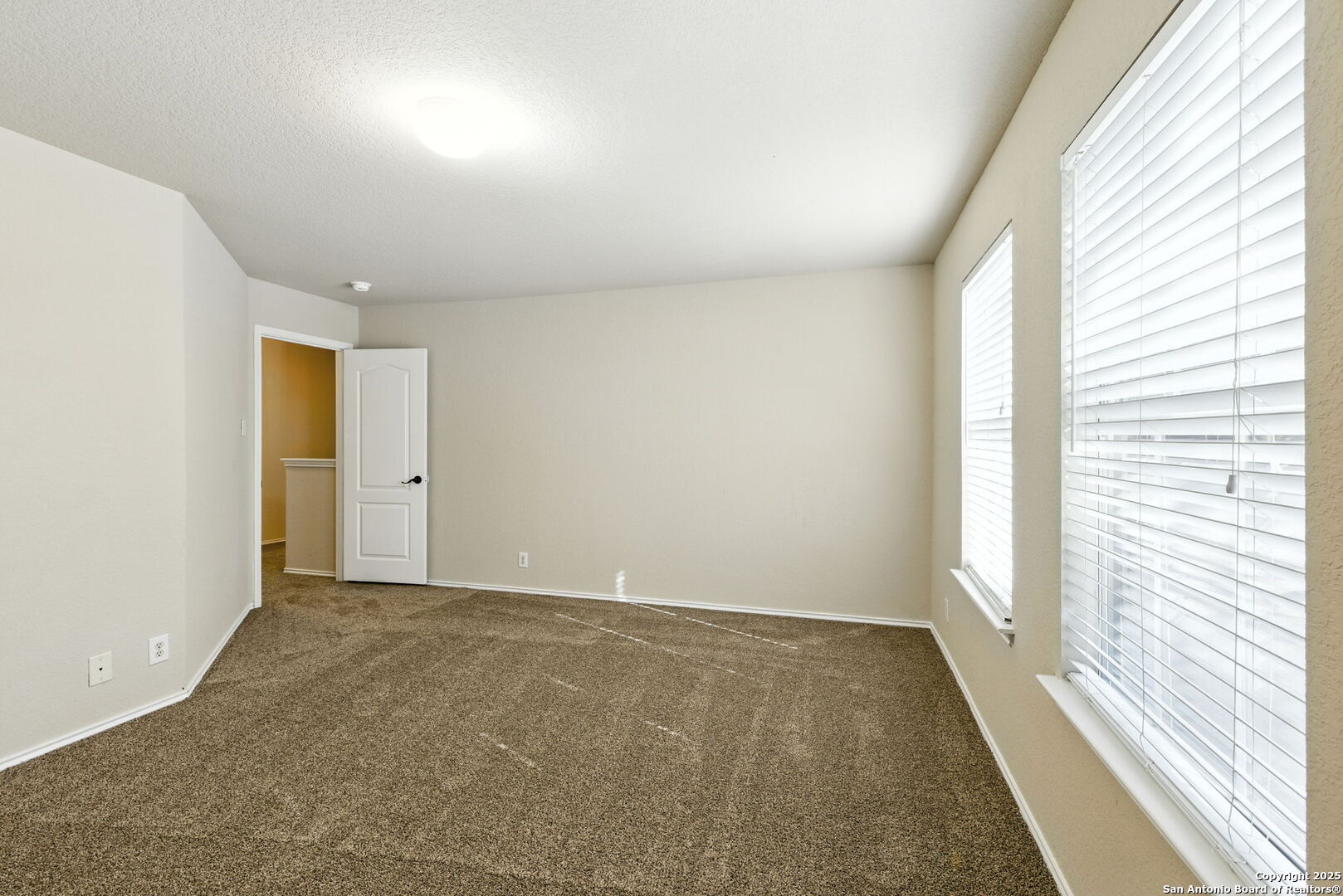 506 Leafy Ridge San Antonio, TX 78251 - Photo 29 of 48 an empty room with windows
