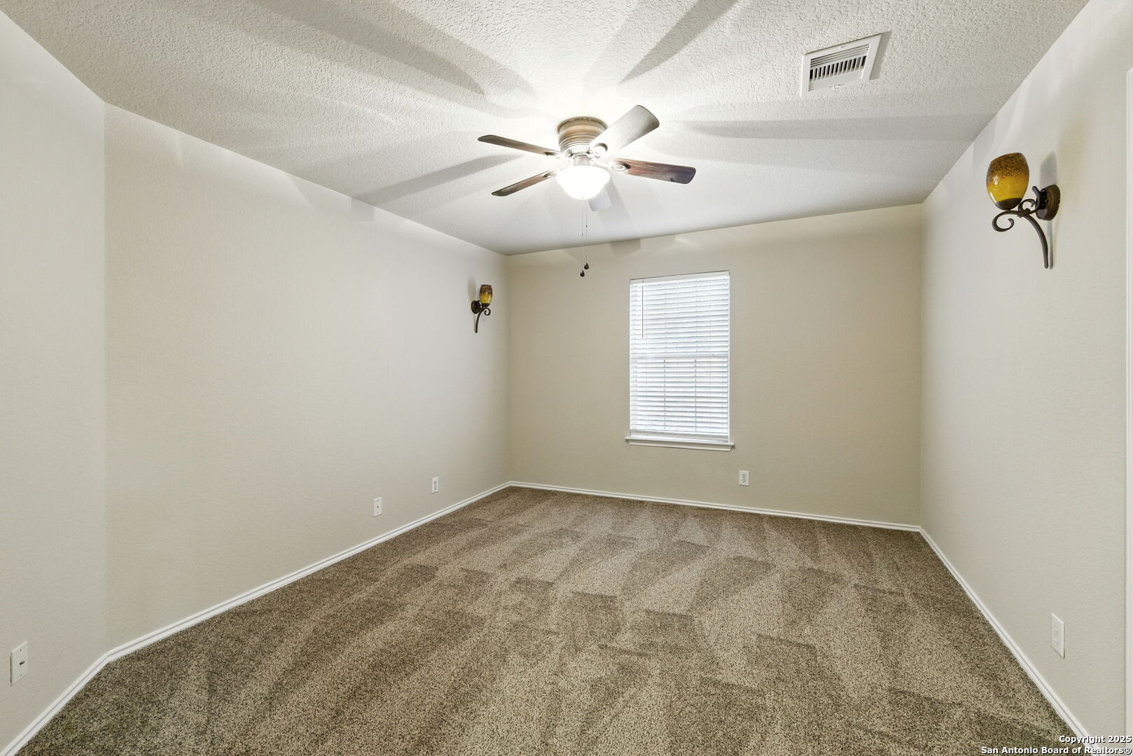 506 Leafy Ridge San Antonio, TX 78251 - Photo 30 of 48 an empty room with windows and fan