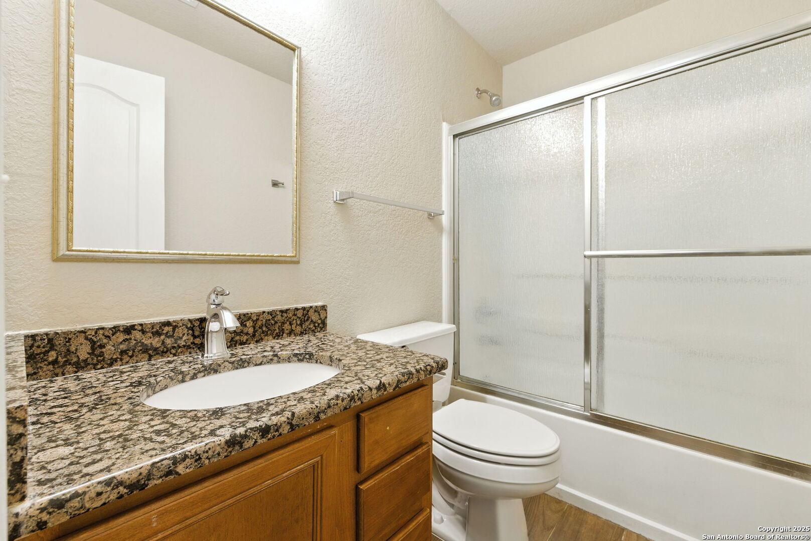506 Leafy Ridge San Antonio, TX 78251 - Photo 38 of 48 a bathroom with a granite countertop sink toilet and shower