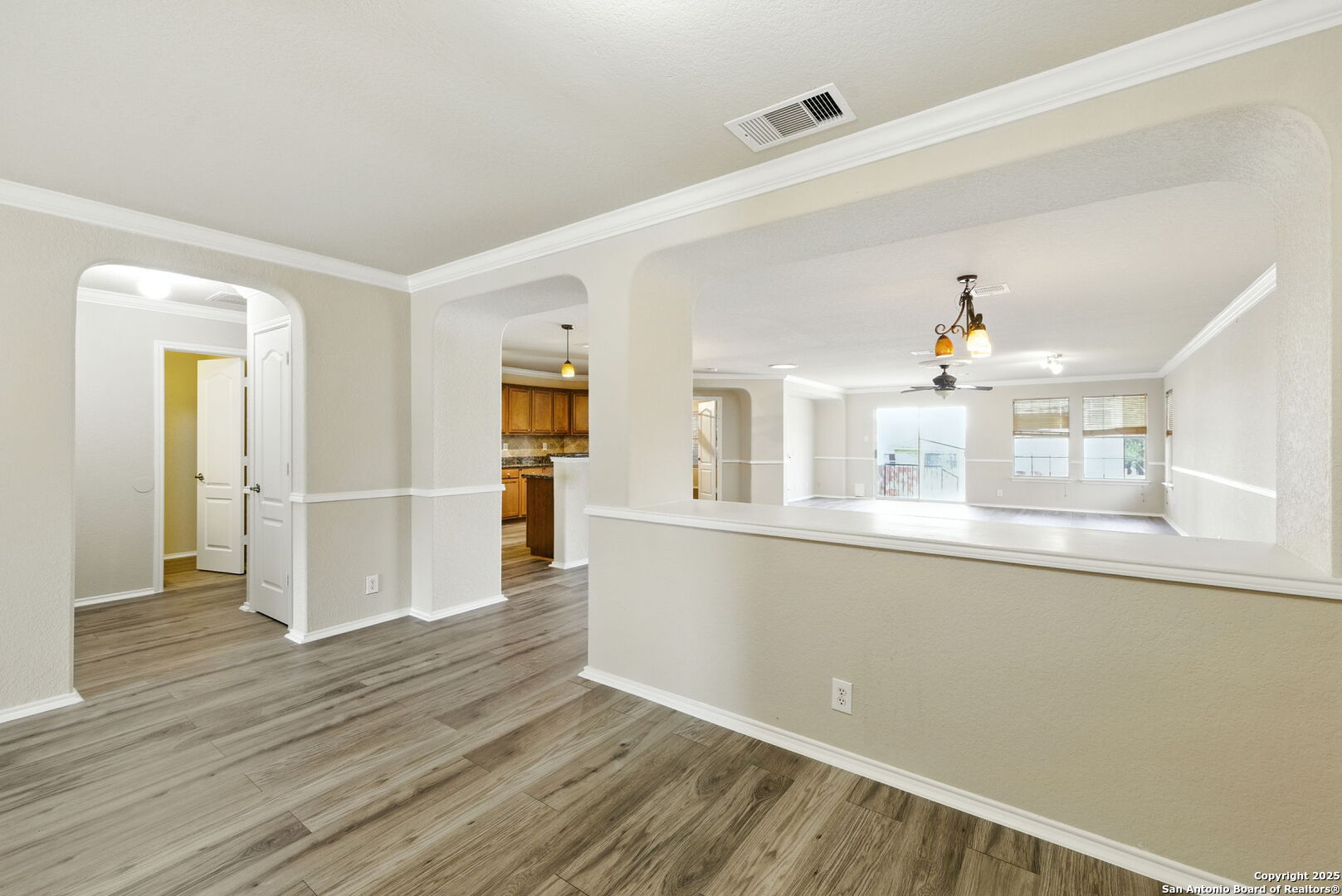 506 Leafy Ridge San Antonio, TX 78251 - Photo 8 of 48 a view of a kitchen with wooden floor and a window