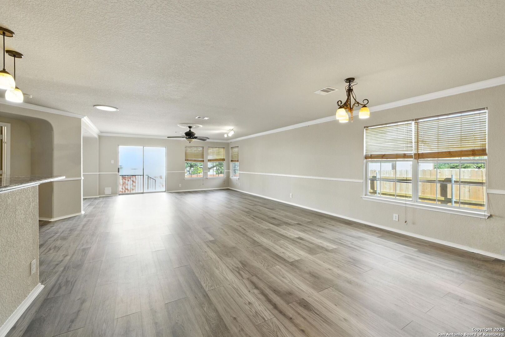 506 Leafy Ridge San Antonio, TX 78251 - Photo 10 of 48 wooden floor in an empty room with a window
