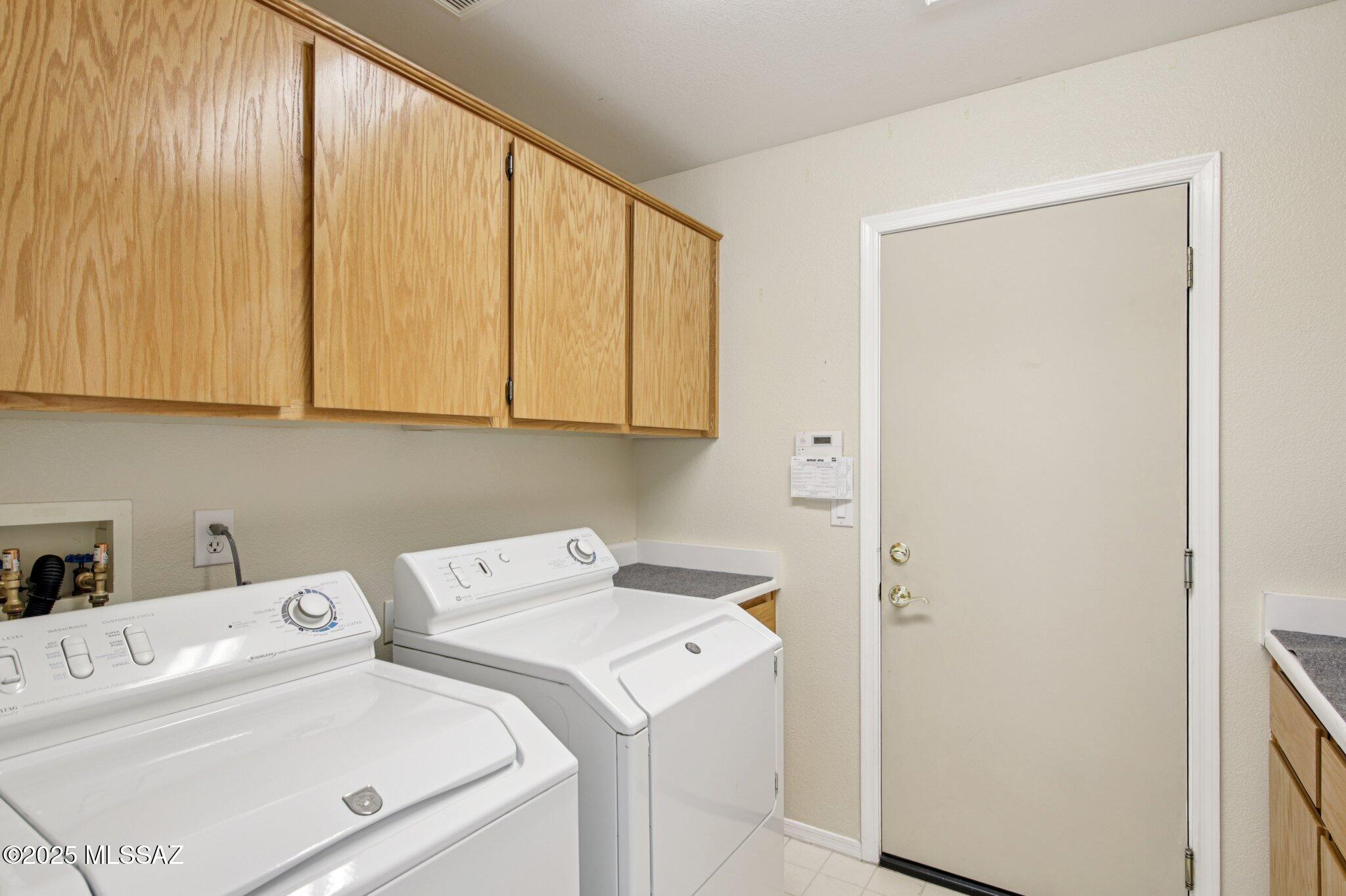35890 Mesa Ridge Drive Tucson, AZ 85739 - Photo 20 of 31 a utility room with dryer and washer