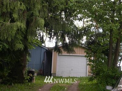 a small barn with a small yard