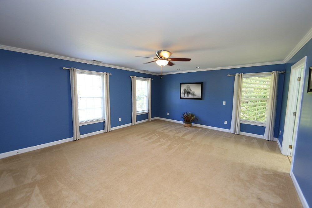 5921 Wild Orchid Trail Raleigh, NC 27613 - Photo 17 of 30 The master bedroom features lots of windows and two walk-in closets. Private luxury bath. Master Bedroom