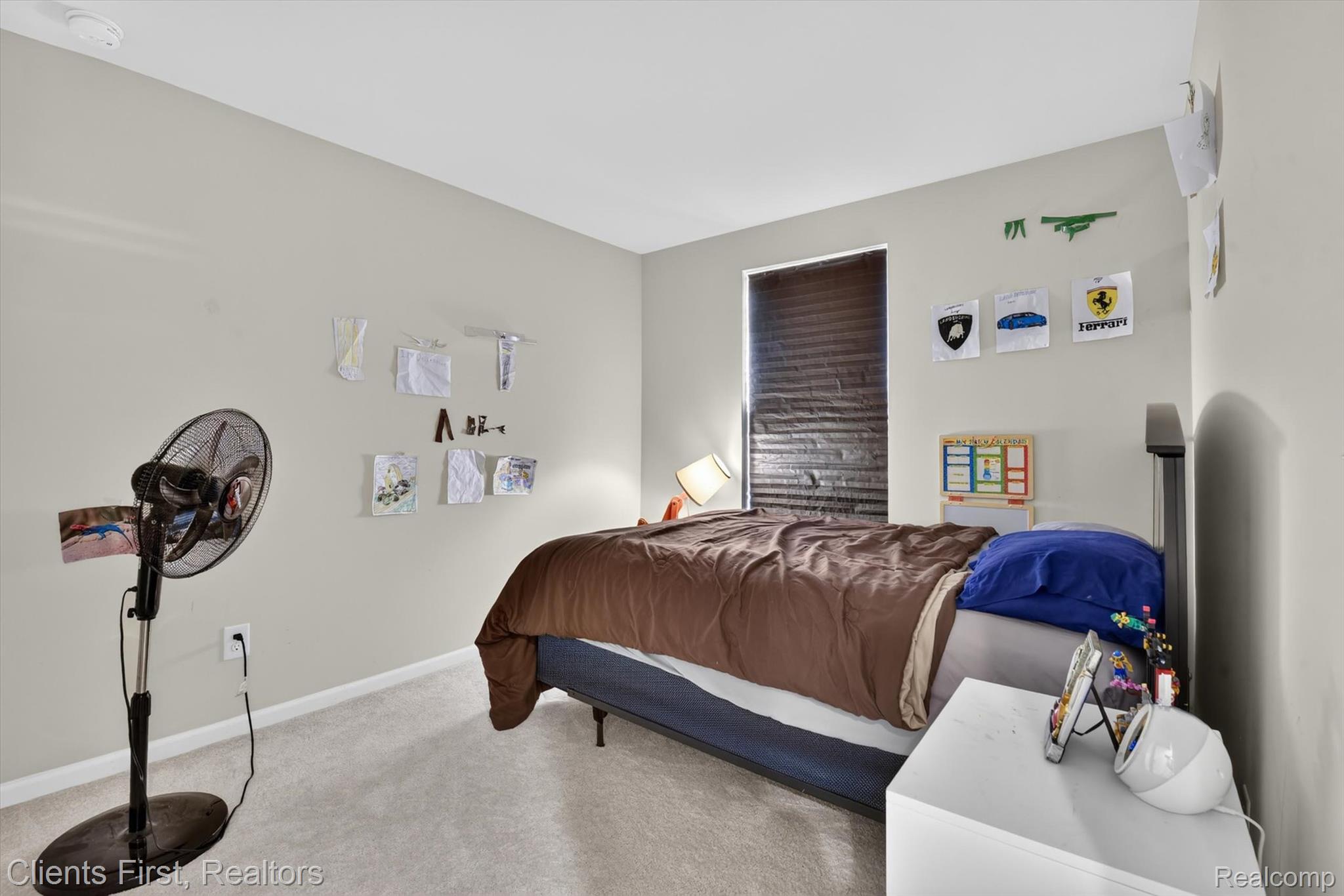 4699 Bingham Road Canton, MI 48188 - Photo 28 of 47 Carpeted room featuring light gray walls, a window with horizontal blinds, and a built-in electrical outlet
