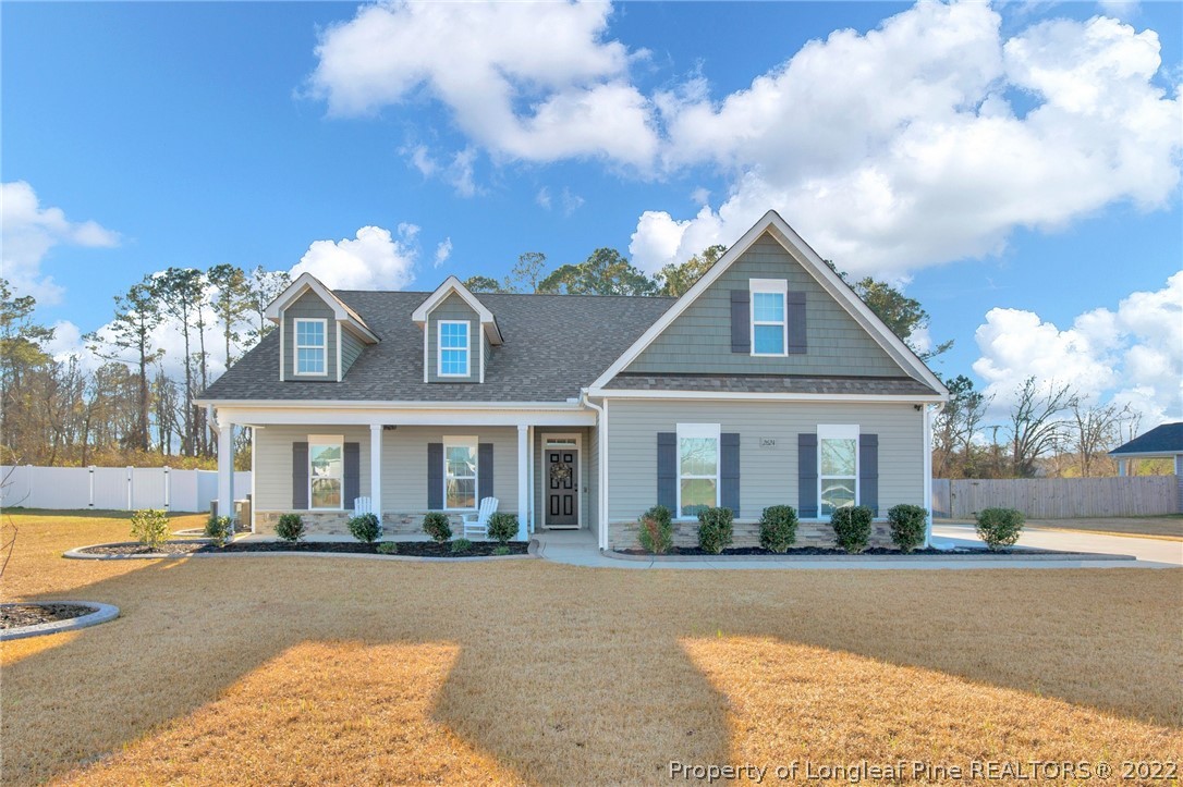 2624 Riddle Farm Road Hope Mills, NC 28348 - Photo 1 of 33 a front view of a house with a yard