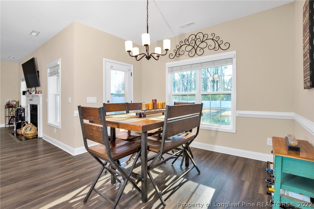 2624 Riddle Farm Road Hope Mills, NC 28348 - Photo 11 of 33 a view of a dining room with furniture window and wooden floor