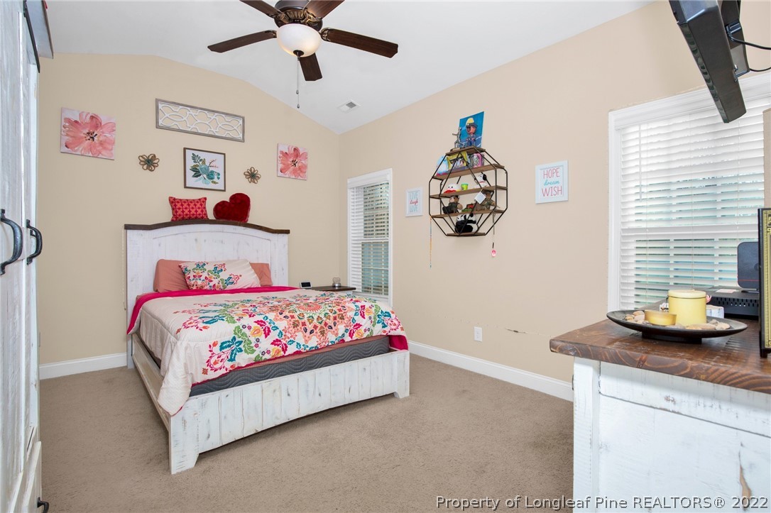 2624 Riddle Farm Road Hope Mills, NC 28348 - Photo 18 of 33 a bedroom with a bed and window