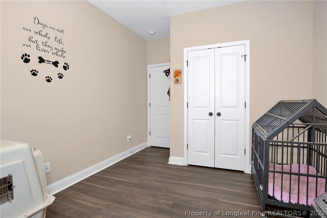 2624 Riddle Farm Road Hope Mills, NC 28348 - Photo 29 of 33 an empty room with wooden floor and white walls