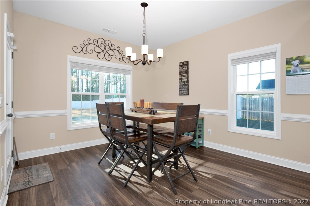 2624 Riddle Farm Road Hope Mills, NC 28348 - Photo 10 of 33 a view of a dining room with furniture window and wooden floor