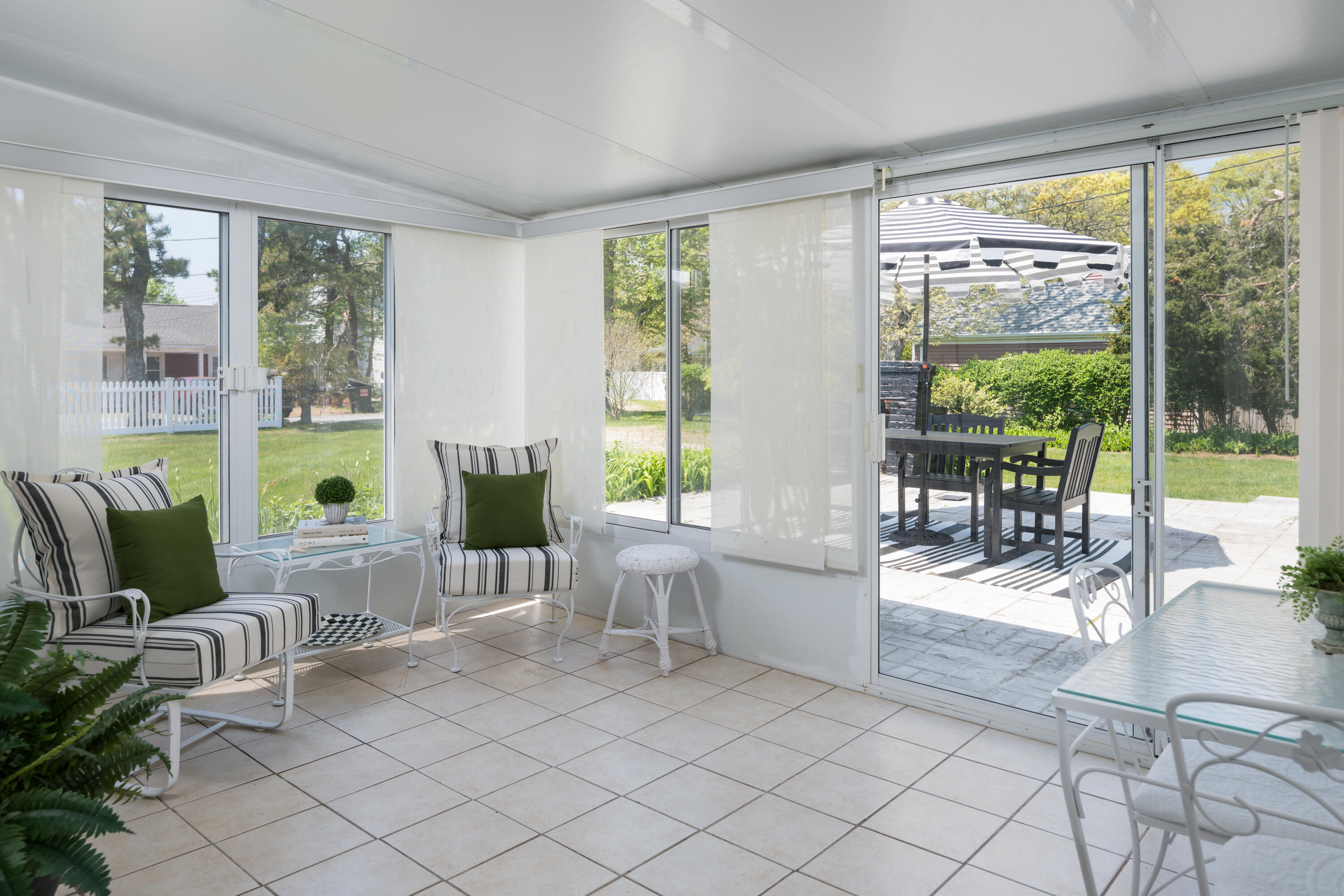 111 Lewis Road West Yarmouth, MA 02673 - Photo 13 of 43 a living room with furniture large windows and wooden floor