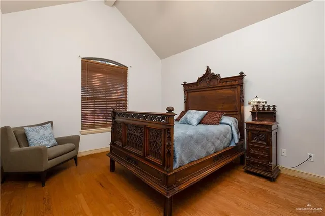a bedroom with a bed and a couch
