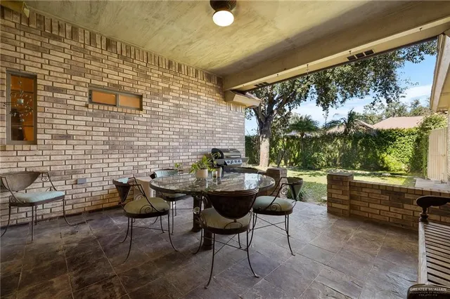 a backyard of a house with outdoor seating