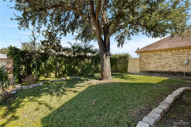 a backyard of a house with lots of green space