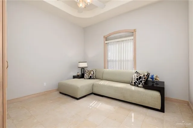 a bedroom with bed couch and window