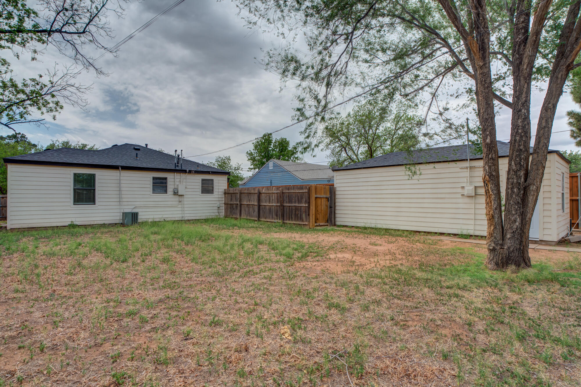 2308 30th Street Lubbock, TX 79411 - Photo 21 of 21 a view of a house with a yard and garage