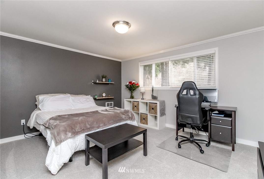 17021 Southeast Jones Road Renton, WA 98058 - Photo 11 of 27 a bedroom with furniture and a window