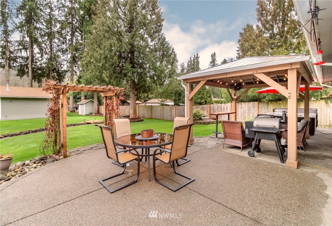 17021 Southeast Jones Road Renton, WA 98058 - Photo 17 of 27 a view of a chairs and table in the patio